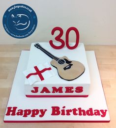 a birthday cake with a guitar and cross on the top that says 30 james happy birthday