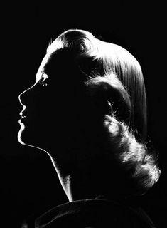 a black and white photo of a woman's profile