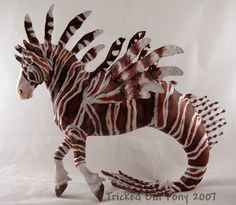 a paper mache of a zebra running on its hind legs