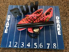 a pair of running shoes on top of a blue mat