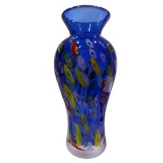 a blue glass vase with colorful designs on it