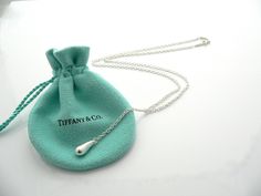 Offered for sale is a gorgeous and very rare Tiffany & Co. Silver Peretti Teardrop Lariat necklace. The piece is crafted from bright and substantial Tiffany silver, with a very pretty teardrop dangling at the end. It is a wonderful necklace that fits a lifestyle on the go -- the necklace can be worn to almost any occasion! It is simple, elegant, and classic all rolled into one necklace. Imagine the piece with your professional office attire ... Now imagine it with jeans or weekend wear ... Perfe Interlocking Circle Necklace, Silver Link Necklace, Cupcake Charms, Tiffany Diamond, Professional Office, Heavy Bags, Office Attire, Teardrop Necklace, Lariat Necklace