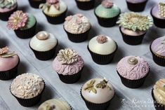 there are many cupcakes that have different designs on them, all decorated in different colors