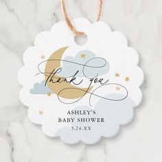 a thank you baby shower gift tag on a marble background