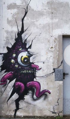 graffiti on the side of a building with a fire hydrant