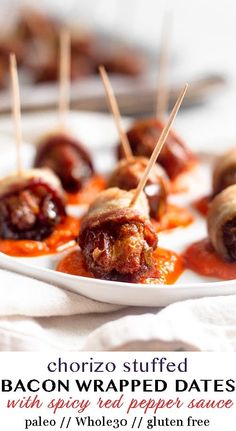 bacon wrapped dates with spicy red pepper sauce are on a white platter and ready to be eaten