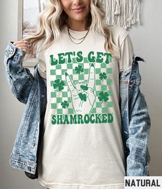 Our funny retro St Patricks Day graphic tee features a Lets Get Shamrocked and checkered background design. This shirt is perfect for Saint Patricks Day pub crawls, bar crawls, or celebrations. 🍀 Lets Get Shamrocked Shirt, Distressed St Patricks Day Graphic Tee, Pub Crawl Tshirt, Funny Drinking Plus Size Shamrock Saint Patricks Tshirt St. Patrick's Day Graphic Print Crew Neck Top, St. Patrick's Day Graphic Tee With Graphic Print, St. Patrick's Day Graphic Tee With Print, St. Patrick's Day Graphic T-shirt, St. Patrick's Day Cotton T-shirt With Letter Print, St. Patrick's Day Graphic Tee, Retro St Patricks Day, Checkered Background, Board Pin