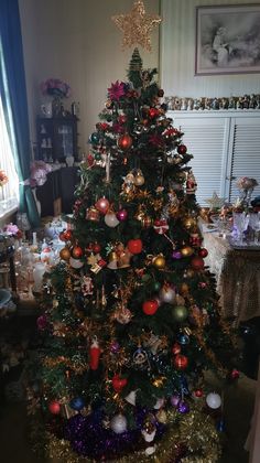 a decorated christmas tree in a living room