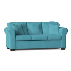 a blue couch sitting on top of a white floor