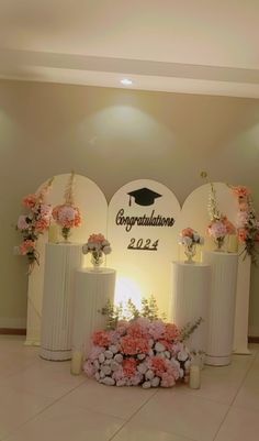 the decorated stage for graduation ceremony with flowers and candles