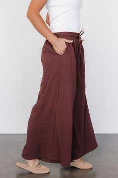 Baltic Born exclusive style The perfect wide-leg pants for traveling, work, or everyday style Puckered gauze-like material Muted warm Brown color Elastic waist with functional drawstring Slash pockets at hip Extra wide leg Marianne is 5'6, cup size 34D, size 6 and wearing size S Brown Wide Leg Ankle-length Pants With Pockets, Brown Ankle-length Wide Leg Pants With Pockets, Brown Wide Leg Pants With Elastic Waistband For Fall, Brown Wide Leg Pants With Drawstring, Versatile Wide Leg Brown Pants, Versatile Brown Wide-leg Pants, Brown Ankle-length Wide Leg Pants For Loungewear, Brown Wide Leg Ankle-length Pants For Loungewear, Brown Relaxed Fit Wide Leg Pants