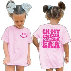 Short Sleeve T-shirt For Summer Cheerleading, Summer Short Sleeve T-shirt For Cheerleading, Cute White Cheerleading Tops, Cute Short Sleeve Cheerleading T-shirt, Cute Crew Neck T-shirt For Cheerleading, Pink Letter Print Tops For Cheerleading, Pink Short Sleeve Top For Cheerleading, Short Sleeve Letter Print Shirt For Cheerleading, Trendy Letter Print Tops For Cheerleading