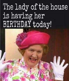 the lady of the house is having her birthday today with hands up in front of her face