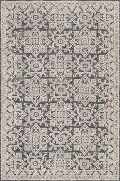 a gray and white rug with an intricate design