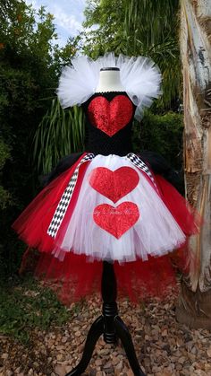 a red and white dress with hearts on it