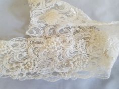 Beaded lace trim with pearls and sequins. Ivory cream beautifully beaded.  Great for invitation cards, candles, votives.  Hand stitched faux pearls and sequins.  Elegant good quality trim and great for bridal veils and ring cushions. Also available in White and Black. Measurement:  8 cm / 3 inches  Listing 1 X Yard of Beaded Lace Trim Ivory  If you require more than the 1 yard listed let me know and I will organise a special listing for you.  I will refund postage in excess of $1.00 Cream Lace For Wedding Night, Cream Lace With Pearl Embroidery For Wedding, Cream Beaded Bridal Accessories For Wedding, Cream Wedding Lace With Pearl Embroidery, Elegant Beaded Lace For Wedding, Cream Lace Bridal Accessories For Party, Cream Bridal Accessories For Mother Of The Bride, Elegant Cream Lace For Bride, Elegant Cream Lace For Mother Of The Bride