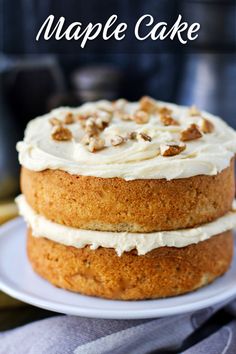 a close up of a cake on a plate with the words maple cake above it