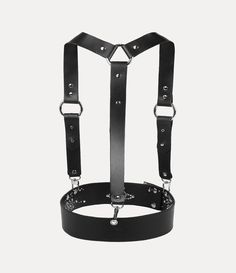 The iconic Studs harness has been revived this season. This reinterpretation for our new collection receives intricate stud detailing with industrial-style straps, complete with an orb at the front of the strap - evoking Vivienne's vision of taking tradition into the future. Punk Style Black Harness With Adjustable Strap, Black Leather Punk Harness, Black Leather Harness With Adjustable Strap, Black Gothic Leather Harness, Adjustable Leather Harness With Belt, Leather Harness With Straps, Leather Strapped Harness With Belt, Leather Harness With Adjustable Strap, Gothic Leather Harness With Belt