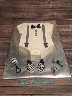 a cake that is shaped like a suit and shoes