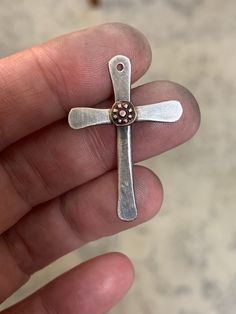 "This unique cross pendant is handcrafted in .925 Sterling silver & features your choice of a copper accent as shown or a bronze accent (gold color / not shown). I oxidize the metal slightly so that it looks a bit rustic & aged.  Each cross is made to order & will have slight variations but will closely resemble the example in the photos.   These necklaces make the perfect gift for anytime or anyone of the faith, but they're most popular as gifts for weddings, baptisms, confirmations, missionari Copper Cross Jewelry For Gifts, Nickel-free Sterling Silver Cross Pendant, Nickel-free Sterling Silver Cross Charm, Artisan Cross Jewelry For Jewelry Making, Artisan Hand Forged Cross Jewelry, Hand Forged Crucifix Jewelry Gift, Rose Gold Sterling Silver Cross Necklace, Artisan Sterling Silver Crucifix Jewelry, Cross Pendant For Men