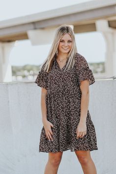 Short sleeve, round neckline, floral shift dress.Sydney is wearing a size smallShift dress fitLinedHEY BABE! WE ONLY OFFER STORE CREDIT FOR RETURNS! Feel free to email us or DM us on Instagram with any questions regarding fit or sizing or our return policy in general. Fall Floral Print Short Sleeve Dresses, Modest Short Sleeve Floral Dress With Ditsy Print, Brown Short Sleeve Dress With Floral Print, Brown Floral Print Mini Dress For Day Out, Modest Short Sleeve Floral Dress, Casual Printed Floral Dress, Brown Floral Print Dress For Dress Down Occasions, Brown Flowy Short Sleeve Dress, Brown Floral Print Midi Dress