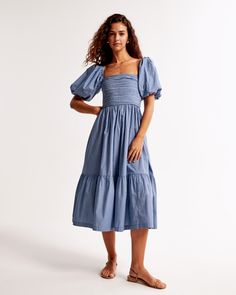 Flattering short-sleeve midi dress in our classic poplin fabric, featuring on-trend puff sleeves, ruching details along the bodice, tiered skirt with pockets and square neckline. Female Features, Blue Stripes Pattern, Puff Sleeve Midi Dress, Chambray Dress, Skirt With Pockets, Midi Short Sleeve Dress, Modern Trend, Santa Baby, Sleeve Midi Dress