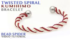 a red and white rope bracelet with two silver balls on the end is featured in an advertisement for twisted spiral kumiko bracelets