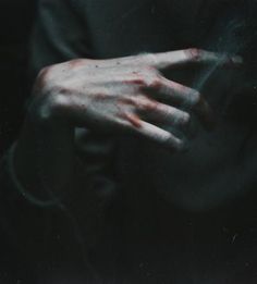 a person with their hands in the dark