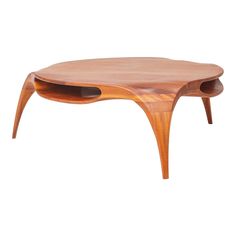 an oval wooden table with two holes in the middle and one hole at the bottom