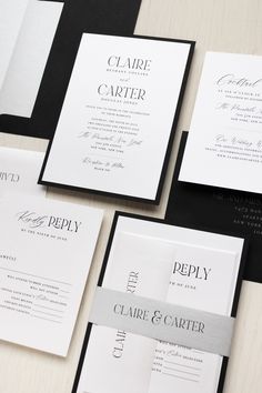 the wedding stationery is laid out in black, white and grey colors with silver foil