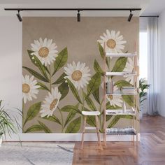 a wall mural with white daisies and green leaves