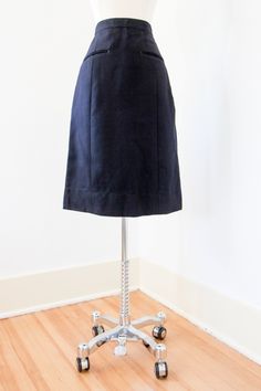 "♛An ideal skirt crafted of a sturdy yet soft and smooth pure wool in an inky navy blue hue, a piece designed and created for the British Navy as regulation wear. This is part of the amazing military collection our shop partner has found. The classic cut can also be easily paired with your modern pieces. This navy hue makes a remarkable neutral...I can't think of many colors it won't work brilliantly with, including unusual pairings like powder pink and chartreuse. Whether you are a full-tilt mi Naval Uniform, Pink And Chartreuse, Military Shorts, Uniform Skirt, Navy Skirt, Full Tilt, Skirt Vintage, Powder Pink, 1960s Vintage