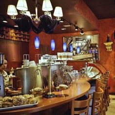 a woman is working behind the counter in a restaurant