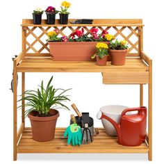 a wooden shelf with potted plants and gardening tools