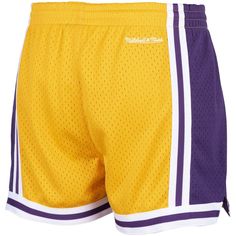 Take over the court like your favorite Los Angeles Lakers players with these Jump Shot shorts by Mitchell & Ness. It features the vintage team logo and colors, along with side split hems for an added flair. These classic Los Angeles Lakers shorts come complete with breathable mesh fabric and an elastic waistband for a perfect fit every time. Brand: Mitchell & Ness Officially licensed Two side slip pockets Machine wash, line dry Imported Contrast-color woven stripes  Elastic waistband with drawst Lakers Players, Lakers Shorts, Family Pajamas, Mitchell & Ness, Side Split, Los Angeles Lakers, The Court, Split Hem, Fashion Advice