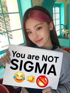 a woman holding up a sign that says you are not sigha with emoticions on it