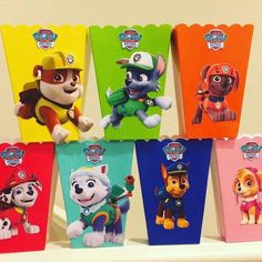 the paw patrol party treat bags are lined up on a shelf with each one in different colors