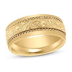 a yellow gold wedding ring with intricate designs