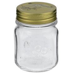 a glass jar with a gold lid