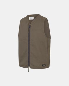 Off-Race Cotton Twill Vest | Pas Normal Studios Functional Breathable Nylon Vest, Khaki Sleeveless Nylon Vest, Nylon Outdoor Vest With Pockets, Sporty Cotton Vest With Moisture-wicking, Pas Normal, Pas Normal Studios, Military Cotton Vest For Outdoor, Ash Brown, Twill Fabric