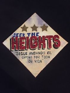 the back of a black shirt that says see the heights with three stars on it