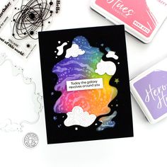 a card with some stamps on it next to other crafting supplies and paper crafts