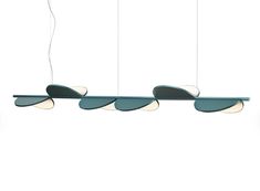 three suspended lights with different shapes and colors