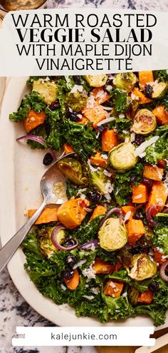 a white plate topped with a salad covered in veggies