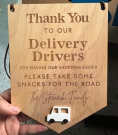 a wooden sign that says thank you to our delivery drivers for making our shopping easier please take some snacks for the road