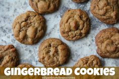 chocolate chip cookies are lined up on a baking sheet with the words gingerbread cookies above them