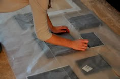 a woman laying on the floor with her feet up