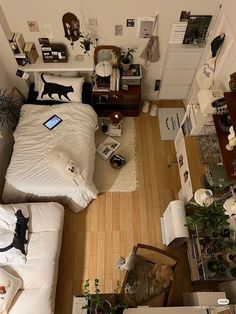 an overhead view of a bedroom with a bed and desk