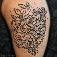 a close up of a tattoo on the back of a person's leg with many different animals