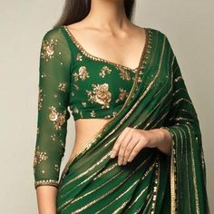 Get ready to make a statement at any Mehendi function with the Mastaani Emerald Green Sequinned Lehenga Set. This absolute favourite is designed in a stunning shade of green, adorned with scattered gold sequins and Swarovski work. The matching blouse features glittering floral motifs, while the dupatta adds an extra touch of glamour with its striped green work. Flaunt your style and elegance with this captivating lehenga set. Composition: Lehenga, Blouse and Dupatta - Georgette All products can be customised for sleeves, length of blouse and neck design Delivery : 4-6 weeks as the product is hand crafted. Check Size Guide or choose MySize for free customisation (All Sizes above XL can be made at 15% additional cost) For more information and sizes please contact fabiliciousfashion@gmail.com Orange Mirror, Green Lehenga, Gold Blouse, Indian Wedding Wear, Lehenga Blouse, Work Skirts, Gold Sequins, Floral Motifs, Wedding Wear